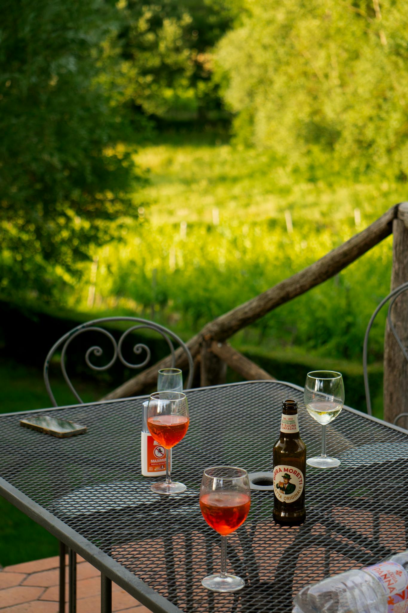 Charming outdoor setting with drinks on a table, perfect for summer relaxation.